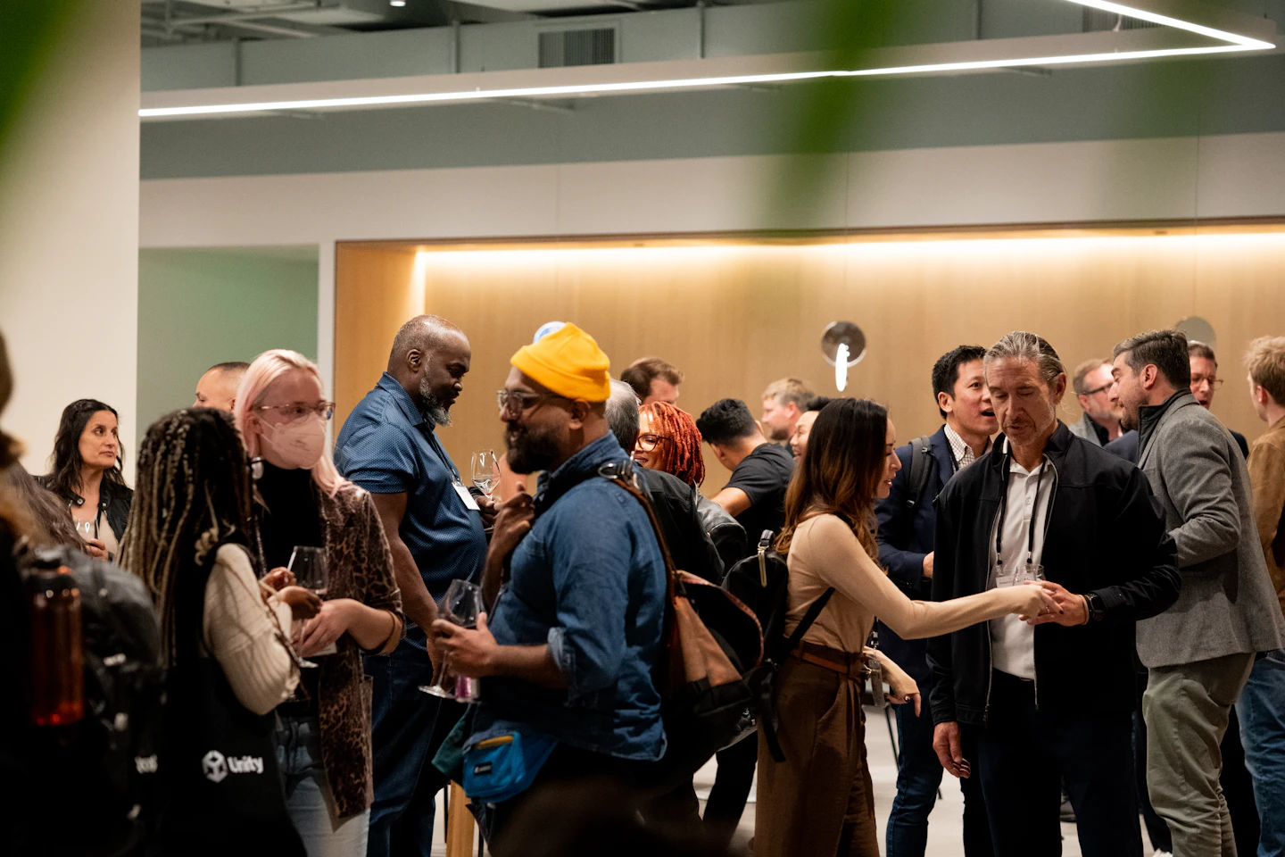 Small groups talking during an industry networking event.